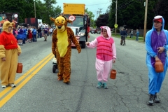 Costumed characters Winnie the Pooh, Tigger, Piglet and Eeyore walk in front of their award-winning float near the start of the 2016 Stevens Alumni parade. The parade theme was Great Books.  Designed by the class of 1971, their float was awarded the George Disnard Memorial trophy. (1/250 sec., F8, automatic-no flash mode, ISO 200, 24mm).Photo: Stephen C. Fitch   June 11, 2016   10:46 AM